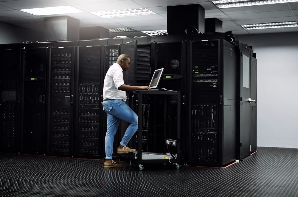 Engineer configuring servers in a data centre